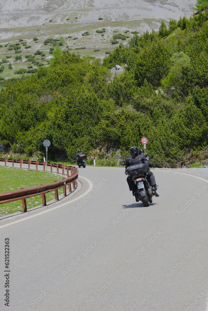Bikers near near the top of the western ramp of the Stelvio Pass