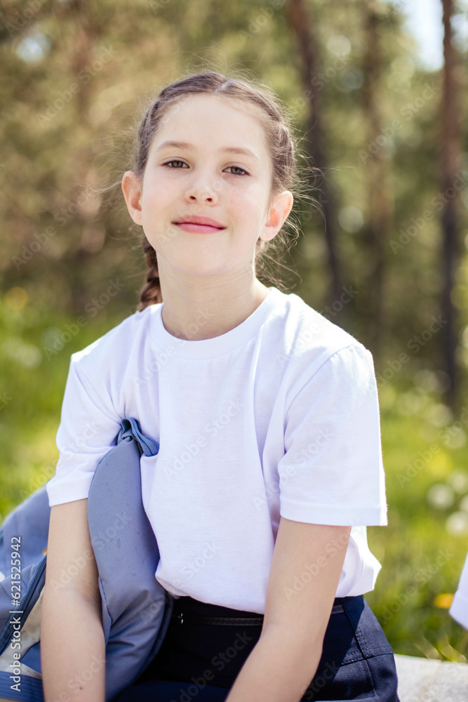 Vertical close-up portrait of a teenage girl, looking at the camera, smiling Vertical close-up portrait of a teenage girl, looking at the camera, smiling