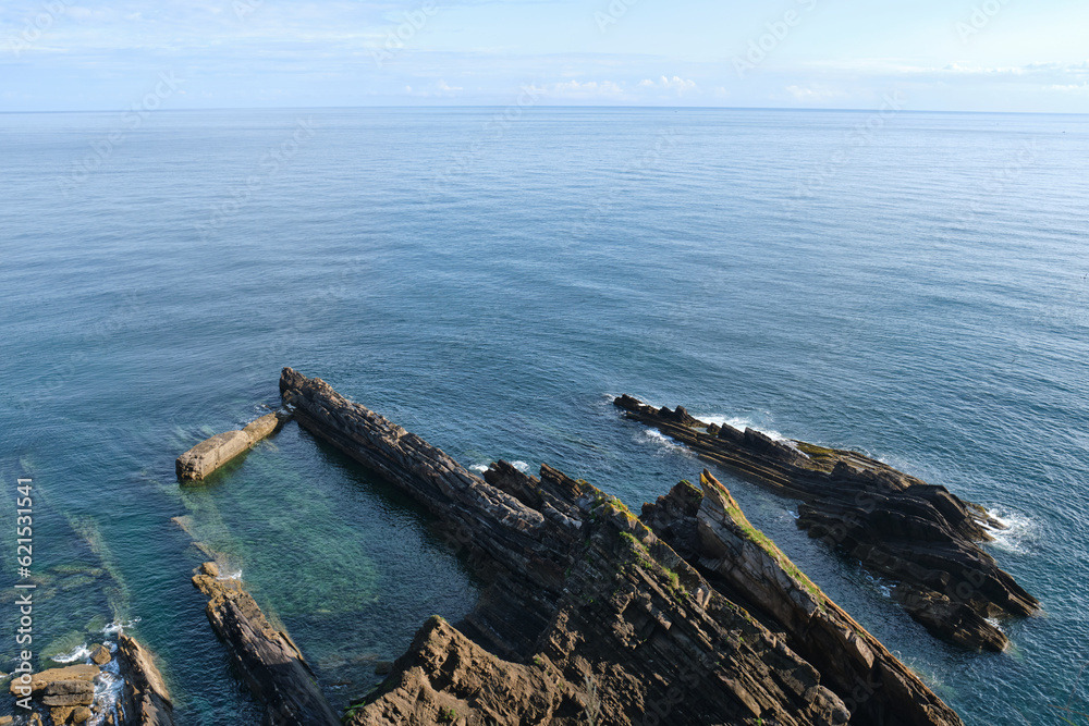 rock formations in front of a calm atlantic sea. Ribadesella, Asturias, Spain