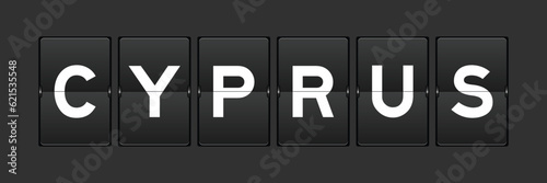 Black color analog flip board with word cyprus on gray background