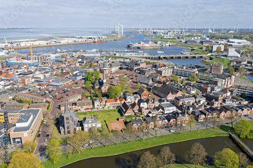 Aerial view Dutch residential area Delfzijl with harbor in the Netherlands photo