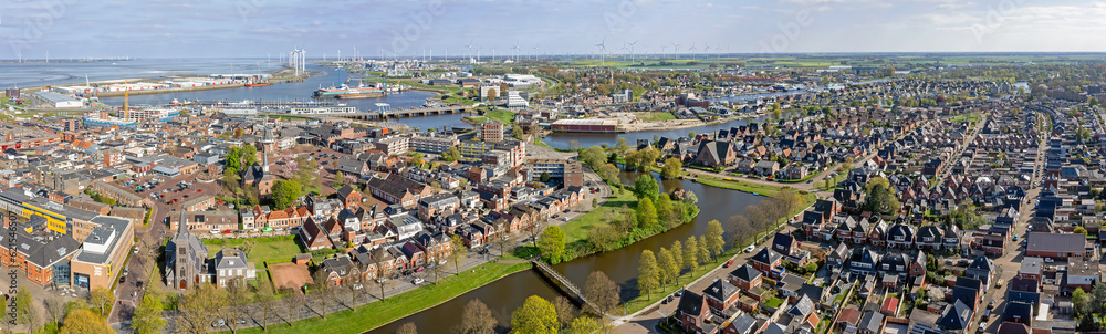 Aerial view Dutch residential area Delfzijl with harbor in the Netherlands