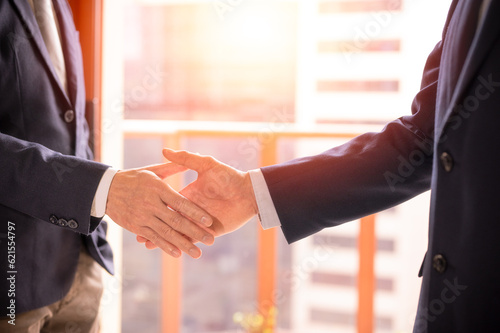 businessman shake hand with partner to celebration partnership and business deal concept, Businessman handshake for teamwork of business merger and acquisition, successful negotiate, hand shake