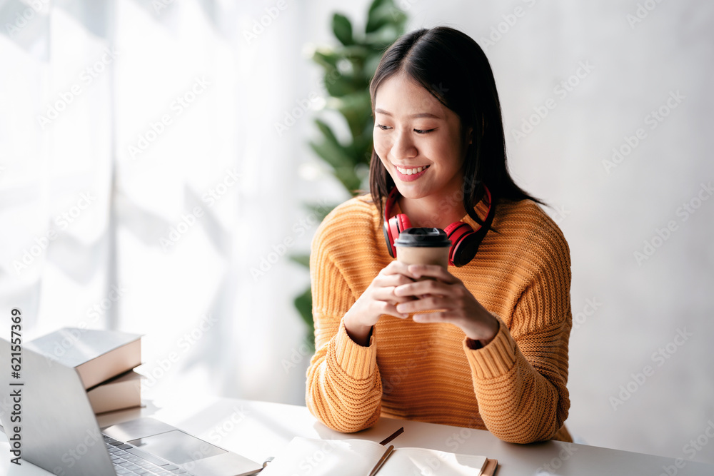 Distance education learning concept, Young woman in sweater stud Distance education learning concept, Young woman in sweater stud