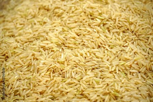 Seeds of dried Brown Rice (Surin jasmine organic unpolished rice), Thai rice varieties are famous and agricultural products for export, readly for cooking,pattern close-up,background