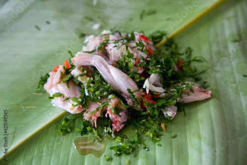 Jungle Frog recipe.The patarashca consists of a dish with ingredients from the region wrapped in bijao leaves that is cooked on the coals. photo