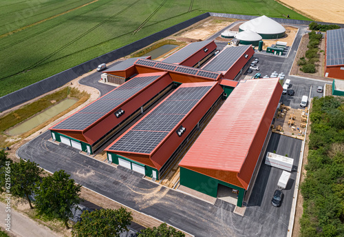 Drohnenfoto - Neubau eines Schweinestalles für mehr Tierwohl, mit einer Biogasanlage und PV - Anlagen auf den Dach. photo