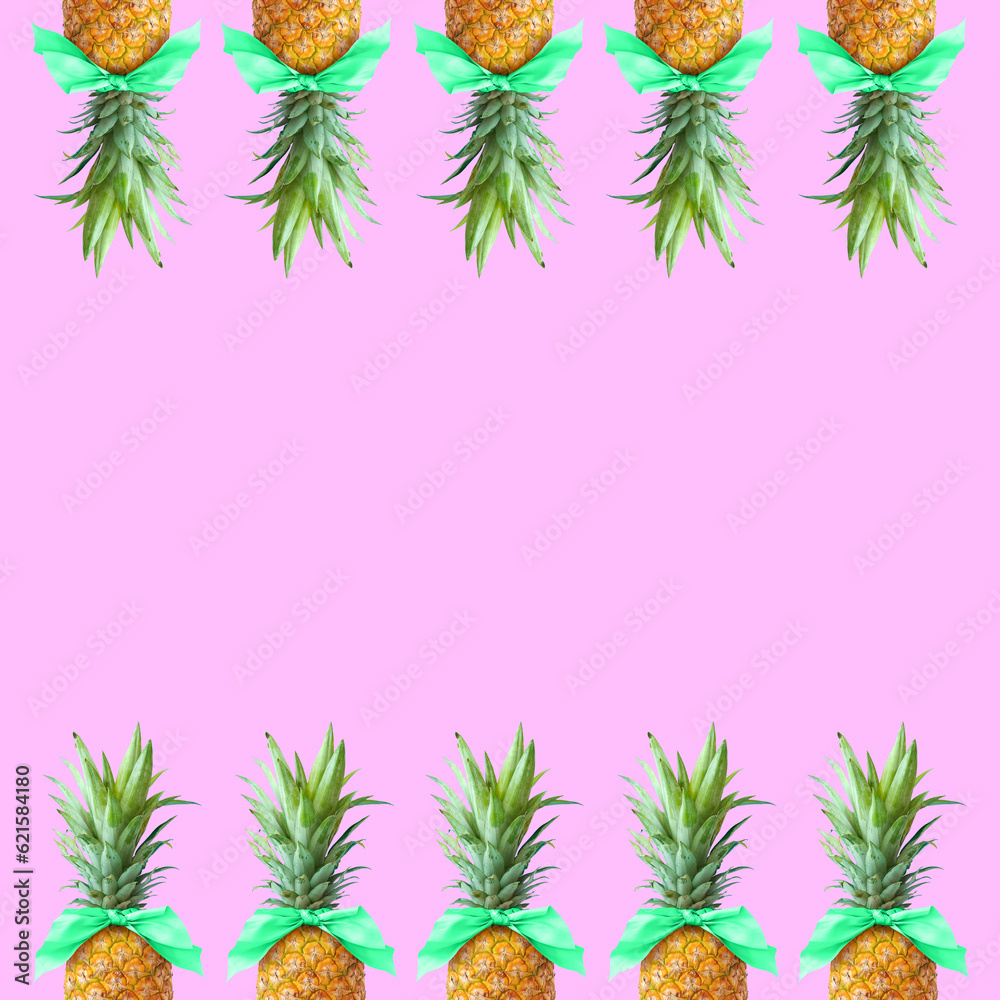 Bonbon candy frame made of pineapple fruit with mint bows on pastel pink background. Original summer design. Minimal fruit concept. Creative advertisement idea. Fruit candy. Pineapple bonbon. 