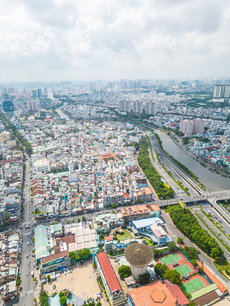 Obraz premium Aerial view of Ho Chi Minh City skyline and skyscrapers in center of heart business at Ho Chi Minh City downtown. Cityscape and many buildings, local houses