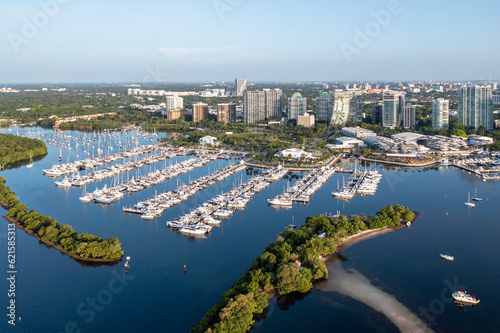 Aerial view of Dinner Key Marina and City of Miami City Hall with Coconut Grove, Miami skyline in background on calm sunny clear summer morning. © Francisco