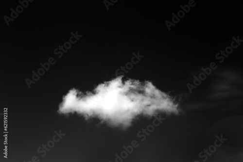 Clouds over black background . 