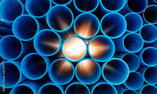 Group of blue water pipes That is stacked into a graphic format With light coming from behind