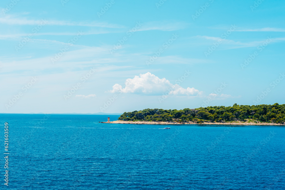 Sea coast with lighthouse and clear blue sky. Adriatic sea, Croatia