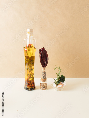 Bottle with olive oil and spices. Infographic food style. Close up. Cooking concept.