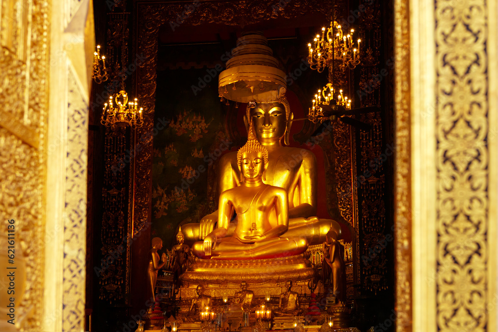 Golden Buddha on the altar of the Buddhist temple of Wat Bowonniwetwiharn Ratchaworawiharn, Bangkok, Thailand.