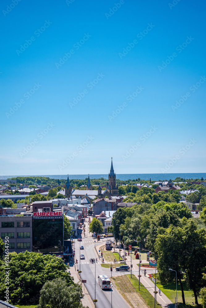 Obraz premium Liepaja, Latvia - June 29, 2023: aerial view of the city centre of the Liepaja city with historical buildings and traffic in the city