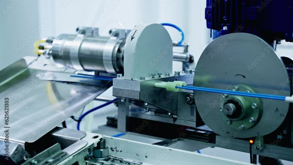 Technology and automation. Factory machine at work. Production equipment at medical industry. 4K, UHD Technology and automation. Factory machine at work. Production equipment at medical industry. 4K, UHD