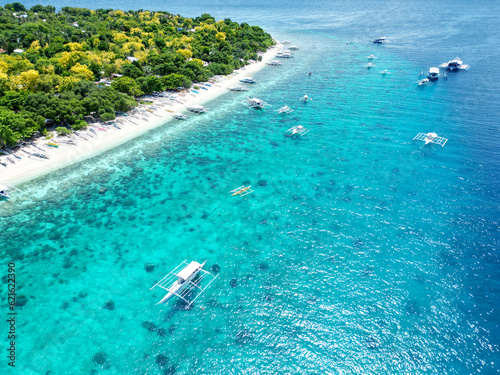 Beautiful beaches and hopping boats on Balikasak Island  Bohol  Philippines  a sacred place for scuba diving  traditional Philippine boats  banca 