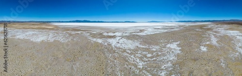 Aerial view of the huge salt flats Salinas Grandes de Jujuy in northern Argentina while traveling South America - Panorama