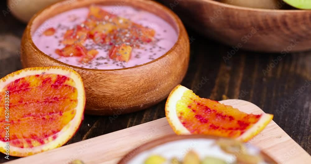 fresh yogurt with berries and fruits with red oranges, delicious dessert yogurt with orange flavor and pieces of fruit fresh yogurt with berries and fruits with red oranges, delicious dessert yogurt with orange flavor and pieces of fruit
