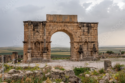 Iconic Triumphal Arch of Volubilis, an old ancient Roman city in Morocco