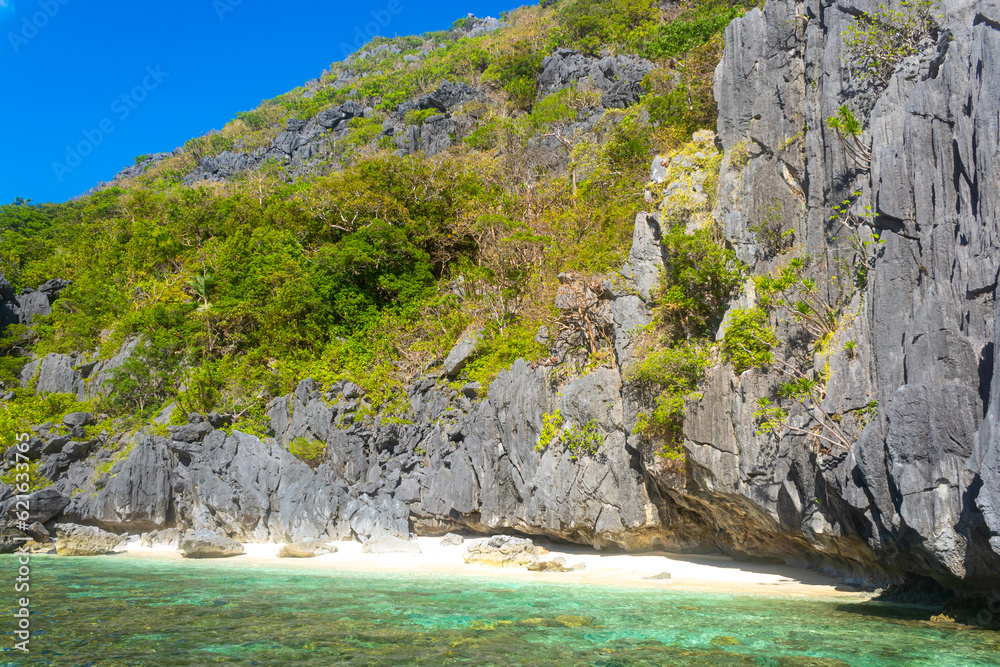 Sandy Beach with Palm Shadows, Huge Rocks, El Nido, Palawan, Philippines Sandy Beach with Palm Shadows, Huge Rocks, El Nido, Palawan, Philippines