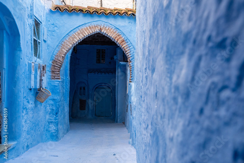 Vibrant blue colored alley in downtown Chefchaouen © imagoDens