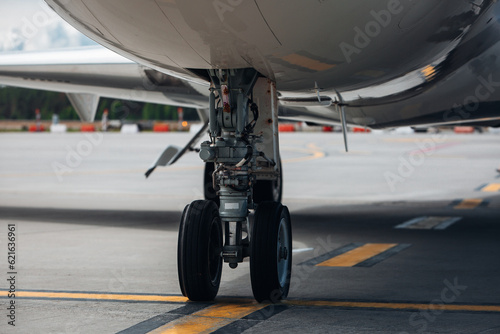 The landing gear of the aircraft standing at the airport for maintenance