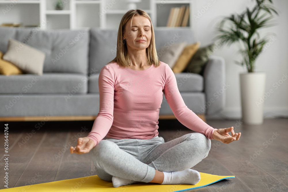 Meditation Concept. Beautiful Calm Woman Meditating At Home In Lotus Position, Meditation Concept. Beautiful Calm Woman Meditating At Home In Lotus Position,