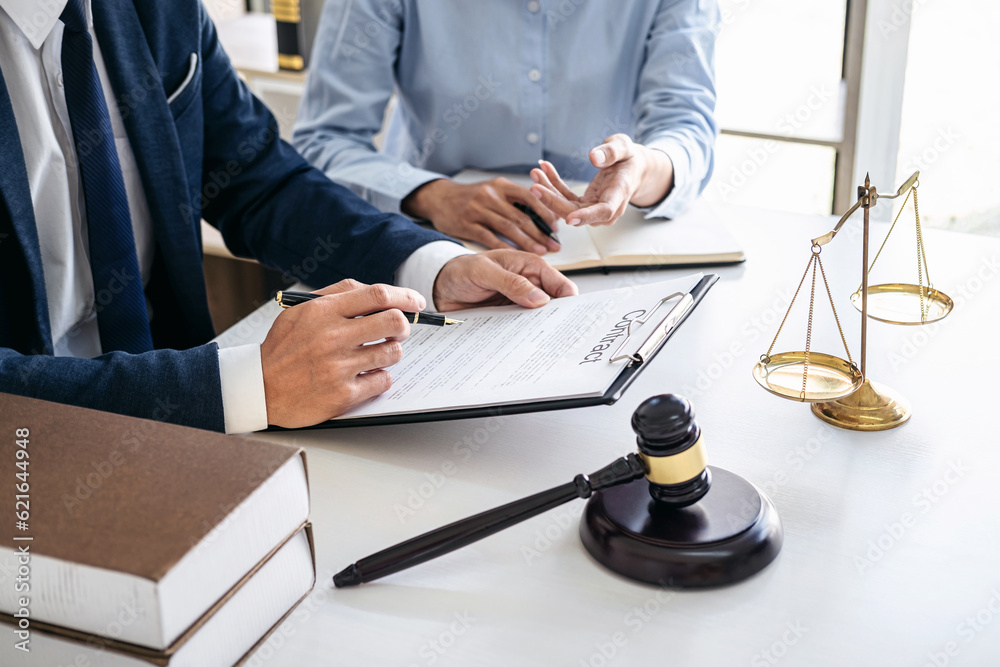 Businesswoman and Male lawyer or judge consult and conference ha Businesswoman and Male lawyer or judge consult and conference ha