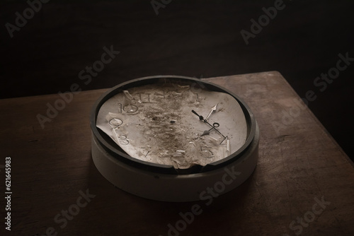 Old and vintage blank clock dial without hand on old wooden table photo