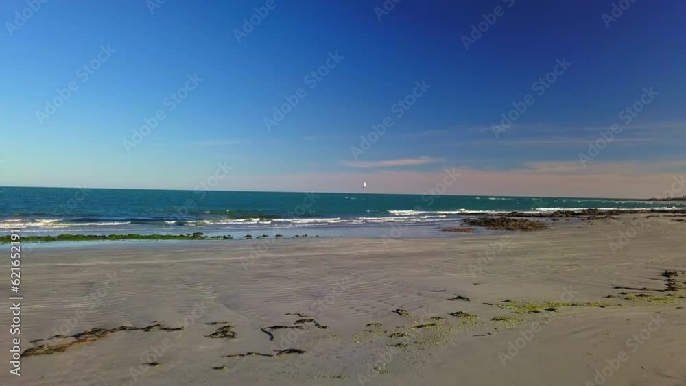 Aerial: Drone Flying Forward Towards Person Kitesurfing On Sea Against Blue Sky During Sunny Day - Baja California, Mexico