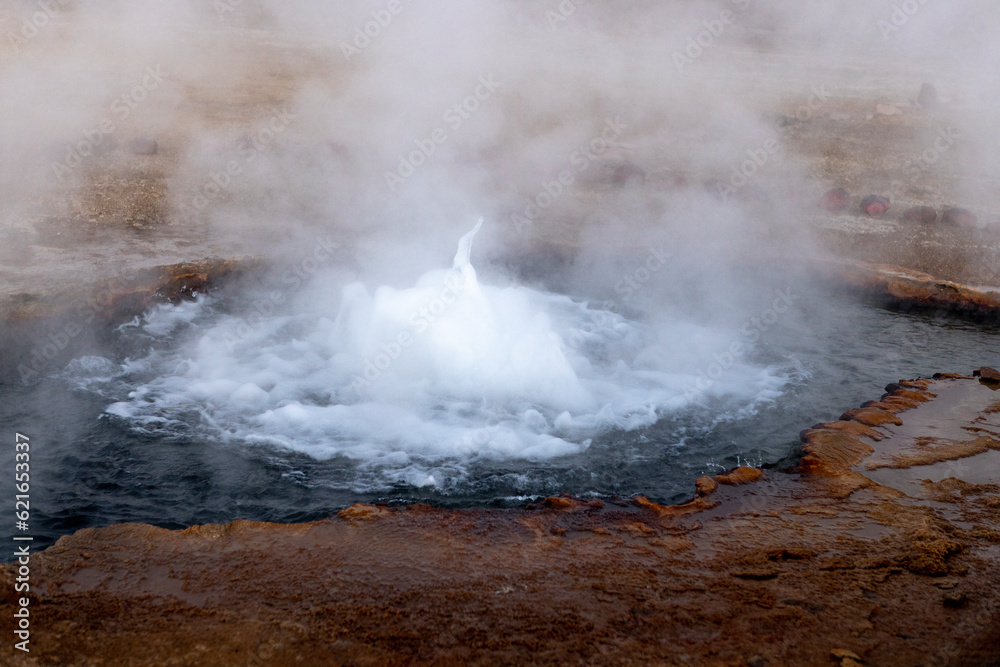 Naklejka premium Exploring the fascinating geothermic fields of El Tatio with its steaming geysers and hot pools high up in the Atacama desert in Chile, South America