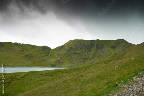 Helvellyn mountain peak with Striding Edge ridge and Red Tarn