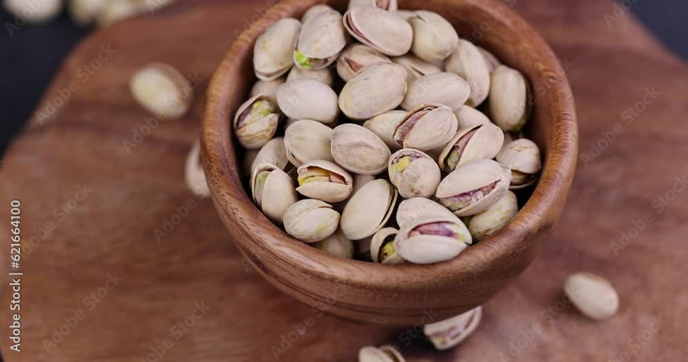 salted pistachio nuts on the table, a large number of salty and crispy pistachios close-up salted pistachio nuts on the table, a large number of salty and crispy pistachios close-up