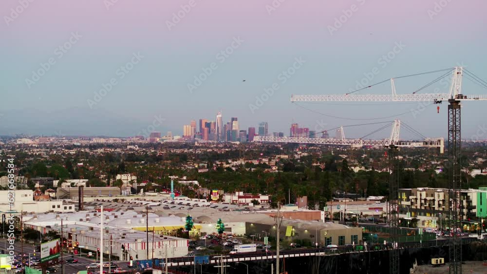 Aerial Panning Shot Of Buildings And Vehicles In City Against Sky, Drone Flying Over Cityscape At Sunset - Culver City, California Aerial Panning Shot Of Buildings And Vehicles In City Against Sky, Drone Flying Over Cityscape At Sunset - Culver City, California