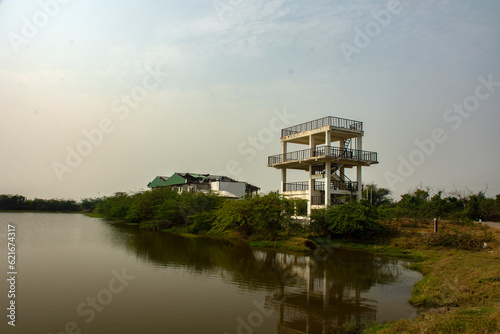 A watch tower just beside a beautiful lake. Selective focus.