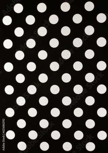 white polka dot pattern on a black background