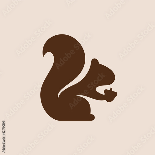silhouette of a squirrel holding an acorn logo
