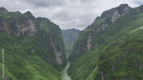 Aerial video of the Nho Quế River in Northern Vietnam - Drone footage of beautiful towering cliffs on either side of river in the Ha Giang province of Vietnam (HDR 4K HLG Rec.2020) photo