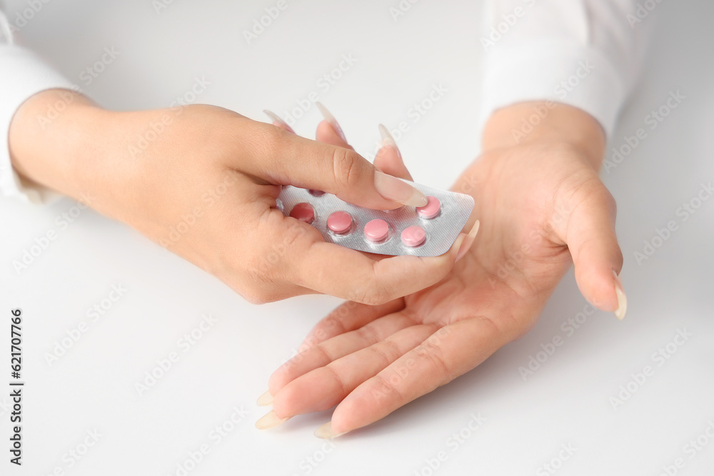 Hands of woman with pills,  closeup