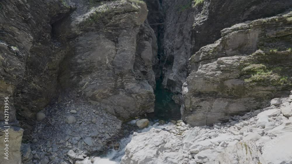 River between rocks of a narrow gorge. Stream of water is squeezed between the sides of the rocks. Viamala Gorge, Viamala-Schlucht. Canton of Graubünden in Switzerland River between rocks of a narrow gorge. Stream of water is squeezed between the sides of the rocks. Viamala Gorge, Viamala-Schlucht. Canton of Graubünden in Switzerland