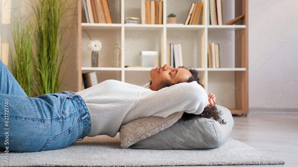 Home relax. Rest indoors. Lazy weekend. Peaceful serene cheerful woman lying on floor comfortable cushions at cozy living room. Home relax. Rest indoors. Lazy weekend. Peaceful serene cheerful woman lying on floor comfortable cushions at cozy living room.