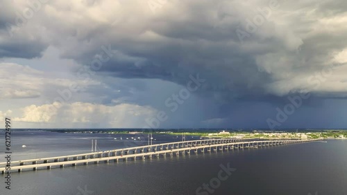 Wallpaper Mural Heavy thunderstorm approaching traffic bridge connecting Punta Gorda and Port Charlotte over Peace River. Bad weather conditions for driving during rainy season in Florida Torontodigital.ca