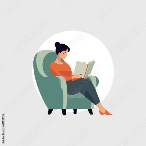 young woman sitting reading a book