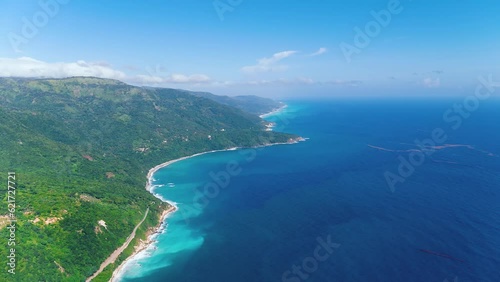 Wallpaper Mural Aerial view of tropical sea coast of Caribbean island with steep green mountains, turquoise water and white beach. Scenic landscape of Dominican wildlife. Calm blue water near the green mountain range Torontodigital.ca