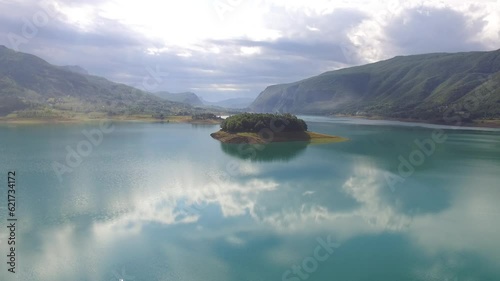 Panoramic view on little islane in the lake photo