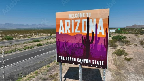 Arizona, The Grand Canyon State. Aerial rising shot of state sign along interstate highway in the desert of AZ. photo