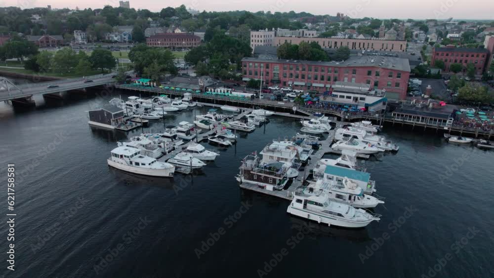 Aerial orbit video over boat docks south of Providence RI with buildings visible at the end. Aerial orbit video over boat docks south of Providence RI with buildings visible at the end.