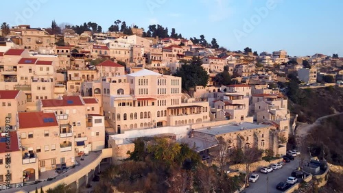 Aerial flyover view of Ancient city of safed, Northern Galilee, Israel. In the center of the frame is a large synagogue. photo